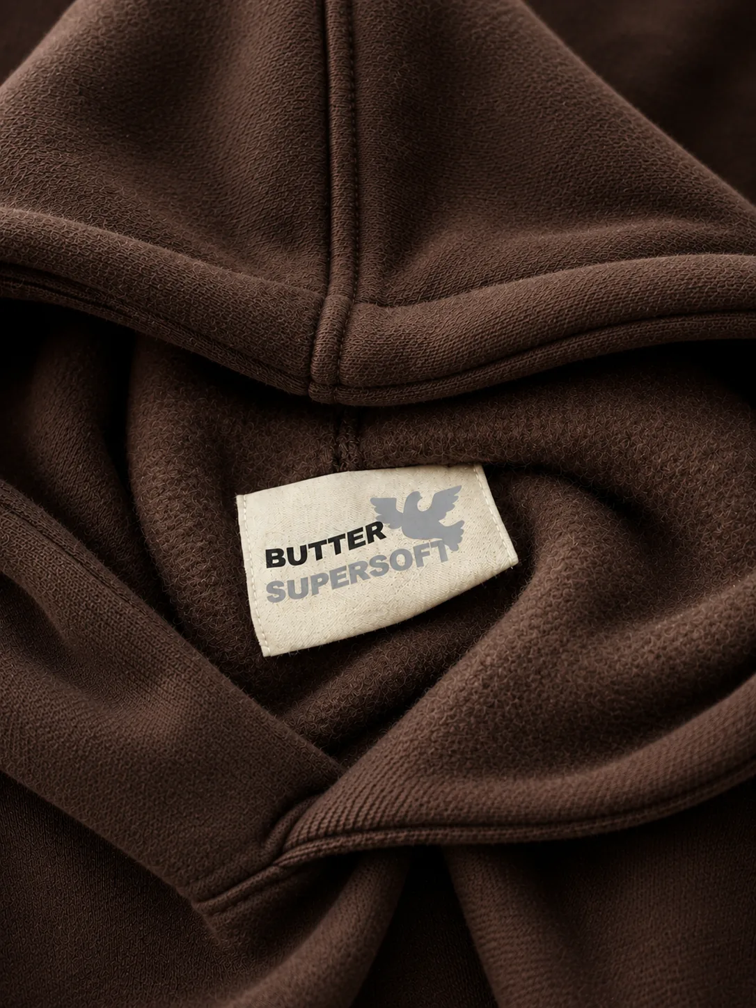 Butter Supersoft label on soft brown fabric