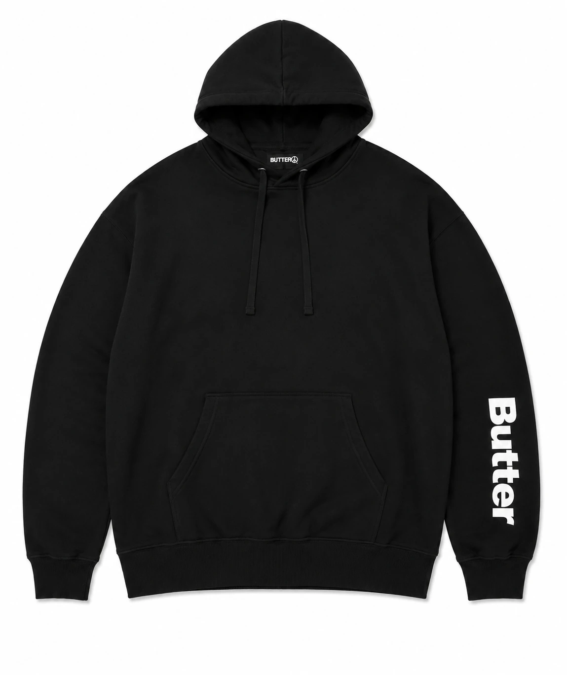 Flat lay of a black pullover hoodie with white Butter text printed vertically on the left sleeve.