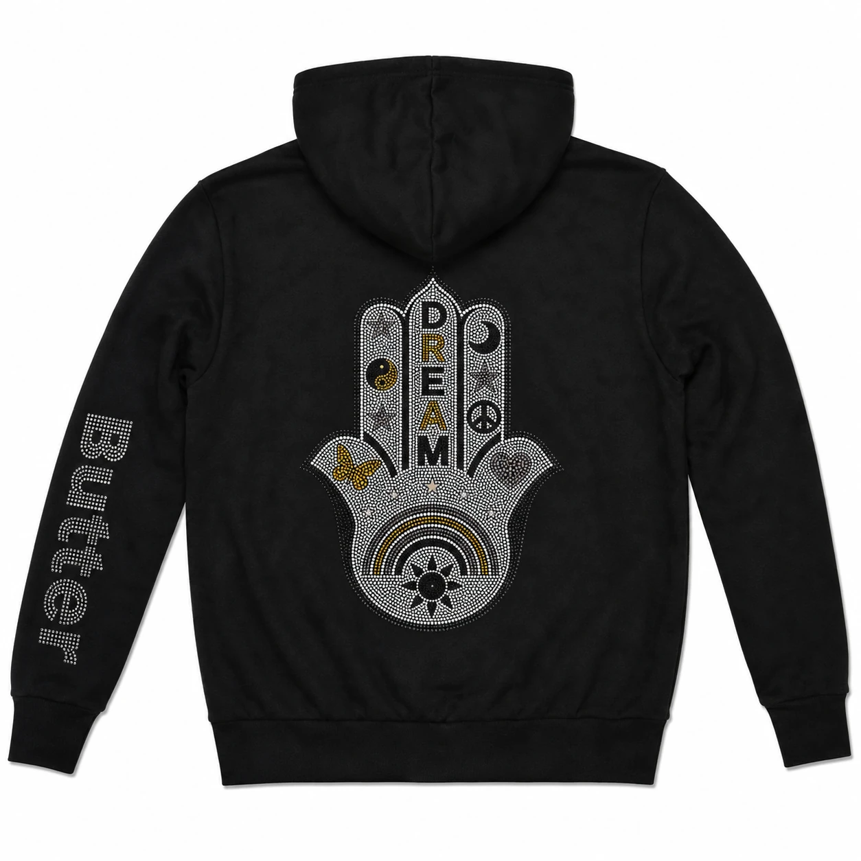 Flat lay of the back of a black hoodie showing a large Hamsa hand graphic with 'DREAM' text and various mystical symbols.