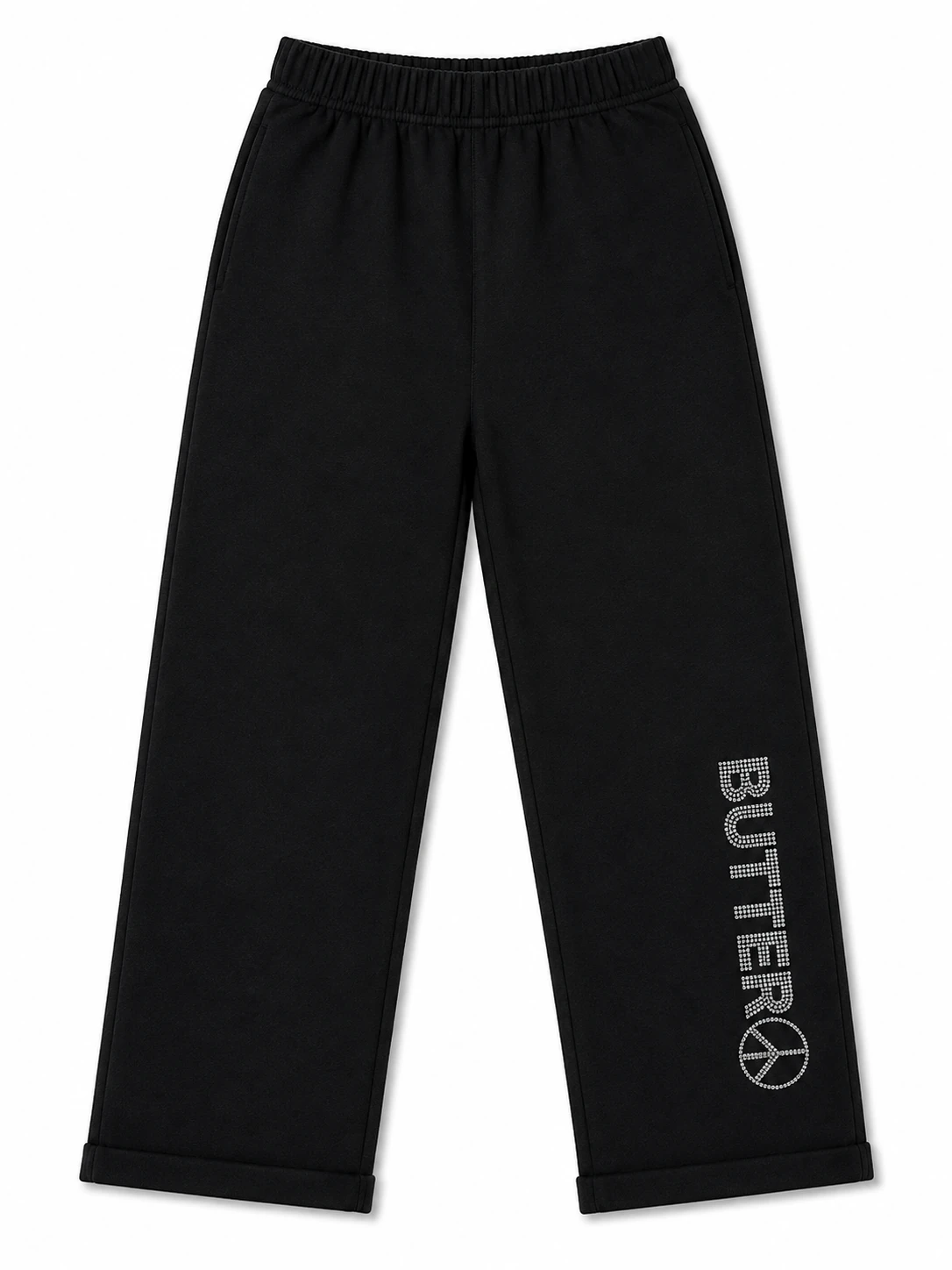 Black wide-leg sweatpants shown in a flat lay. A rhinestone 'BUTTER' logo with a peace sign is visible on the lower left leg.