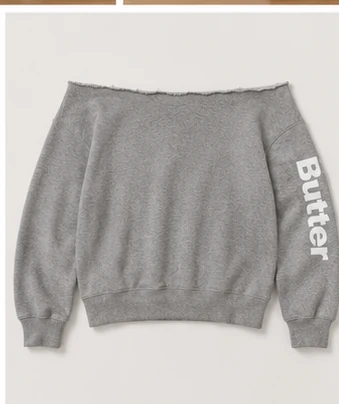 Heather grey off-the-shoulder sweatshirt with a raw-cut neckline and 'Butter' printed on the sleeve.