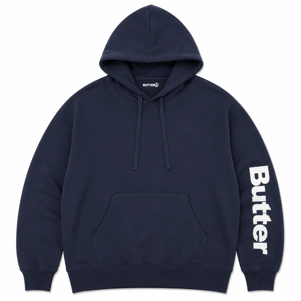 Flat lay of a navy blue pullover hoodie with white Butter text branding on the sleeve.