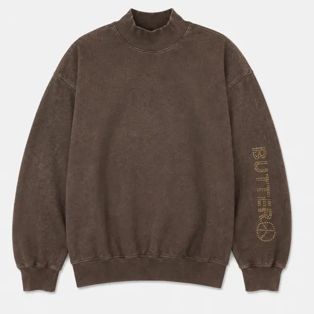 Brown mock neck sweatshirt with a gold rhinestone 'BUTTER' logo on the left sleeve.