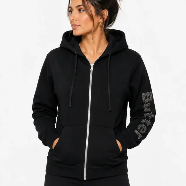 Model wearing a black zip-up hoodie with 'Butter' branding on the sleeve, shown from the front against a white background.