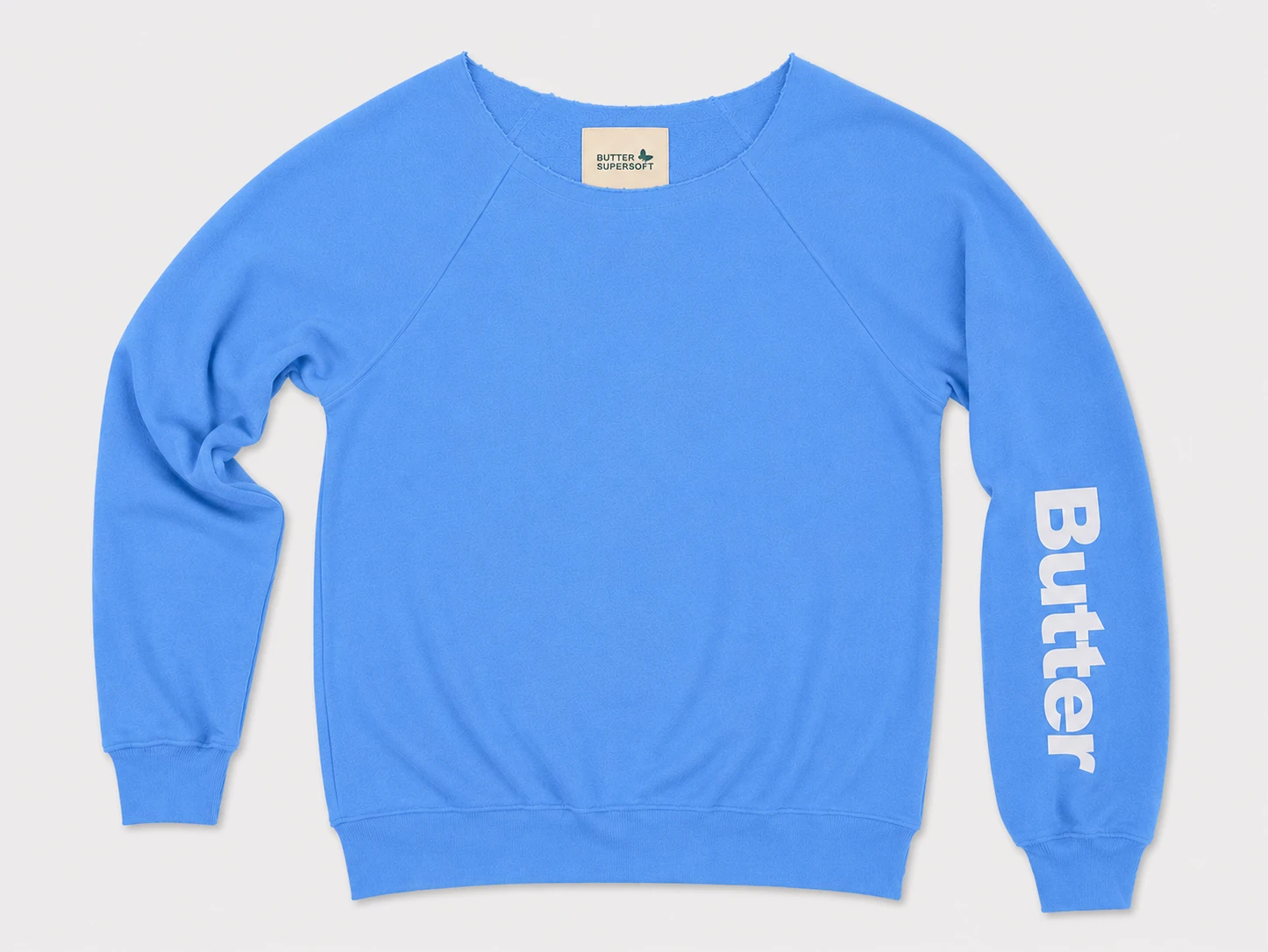 Bright blue off-the-shoulder sweatshirt with a white vertical logo on the left sleeve and raglan sleeve construction.